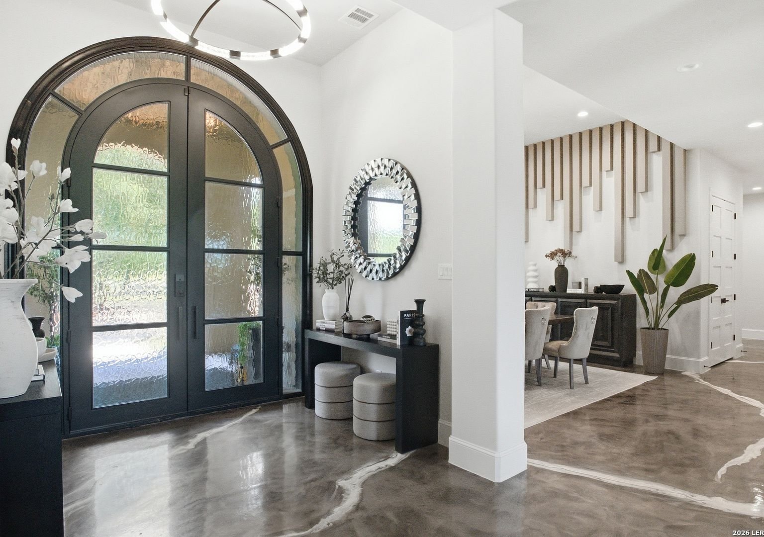 Arched entry with round mirror