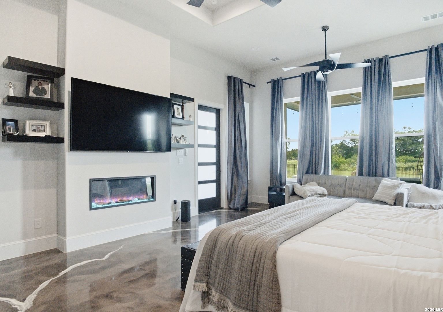 Primary bedroom with charcoal accent wall