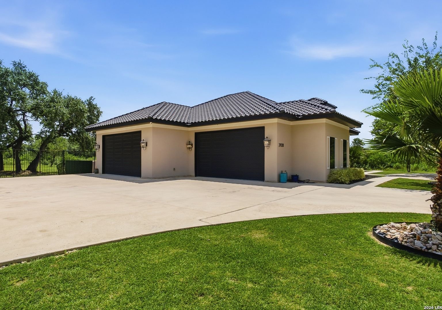 Four-car garage and circular driveway